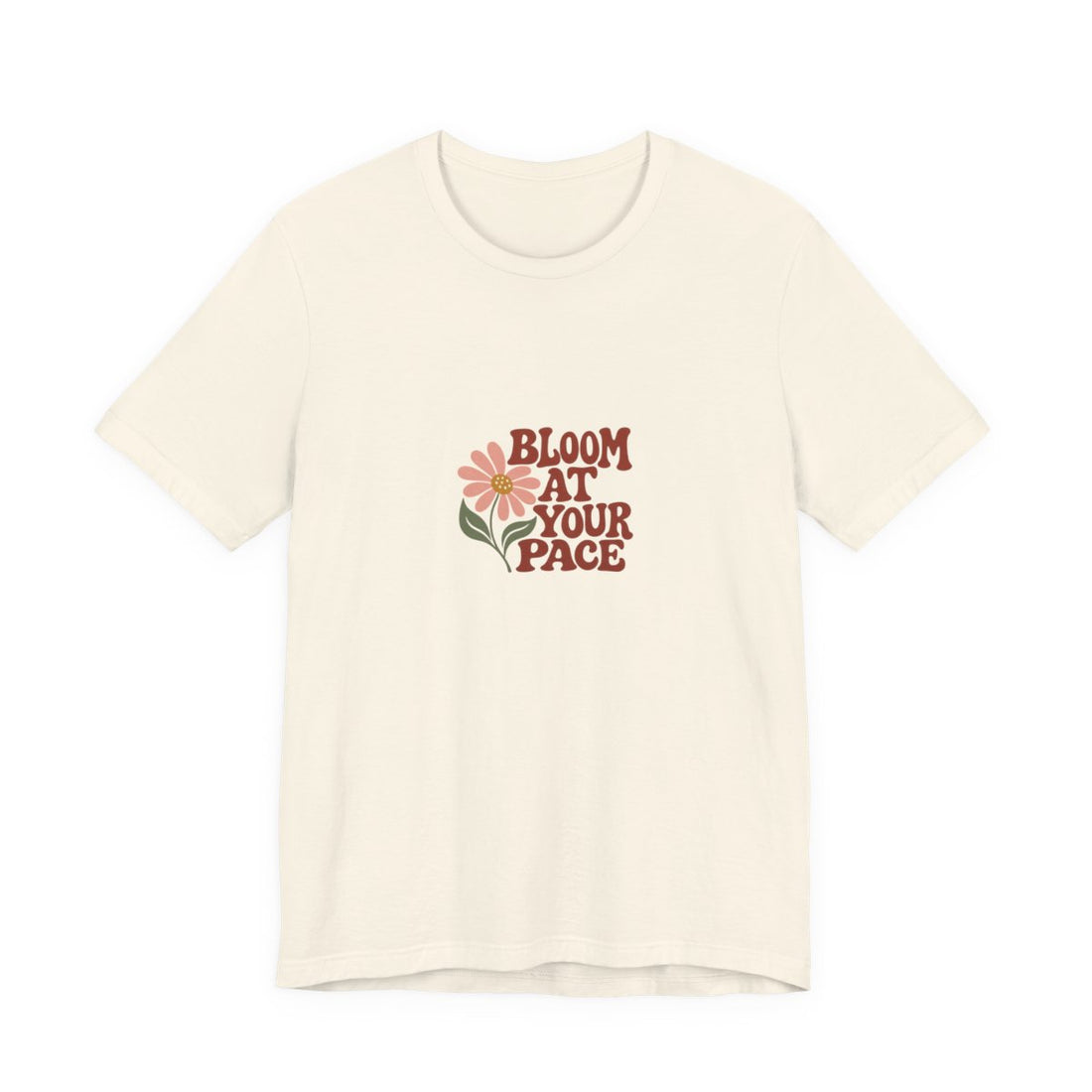 The Bloom at Your Pace Tee — Natural Bella+Canvas 3001 front mockup with original STAND GIRLS artwork